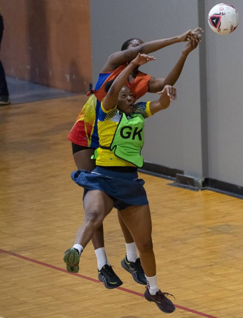 Defense Force GK, Camille Alexis kept MIC Tigers' GS Tiffany Gonzalez on her tippy-toes in their opening round KO match on opening day of Courts All Sectors Netball League. - Photo by Dennis Allen for @TTGameplan