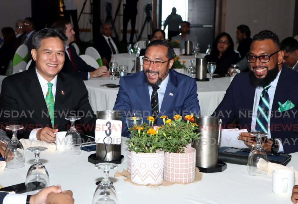 From left, NGC president Mark Loquan, Minister of Energy and Energy Industries Stuart Young, and NGC chairman Dr Joseph Ishmael Khan share a joke during the launch of the NGC Green Company Ltd on Wednesday.  - Ayanna Kinsale