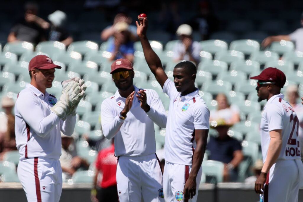 West Indies' Shamar Joseph, second right, holds up the ball after taking five wickets against Australia on the second day of the first Test match in Adelaide, Australia on Thursday. - AP PHOTO