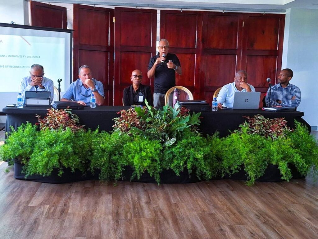 SporTT chairman Douglas Camacho (C) speaks to representatives from varying NGBs at a stakeholder meeting at the Hasely Crawford Stasdium, Mucurapo on January 17.  - SporTT
