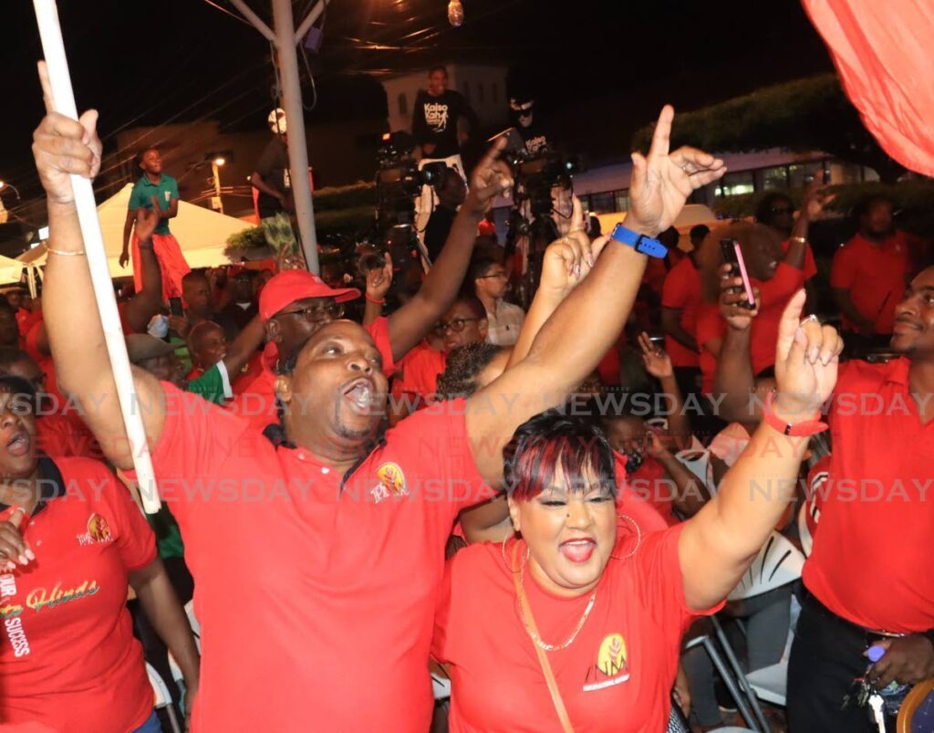 PNM supporters cheer during an entertainment segment at a People's National Movement public meeting. - File photo