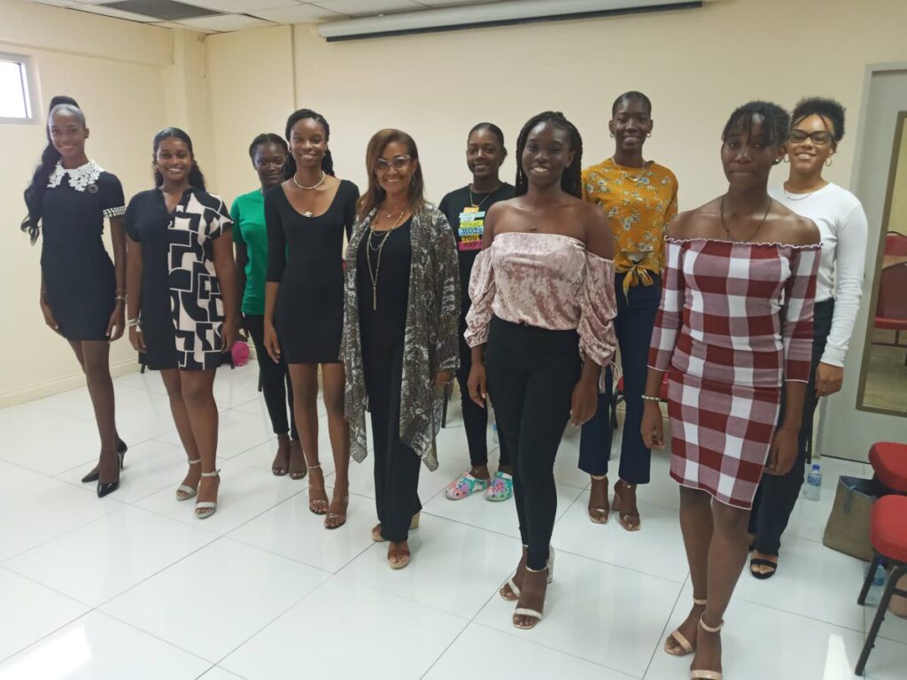 Some of the delegates pose with Miss world 1986 Giselle La Ronde West, centre, during a training workshops at Scarborough Library. - 