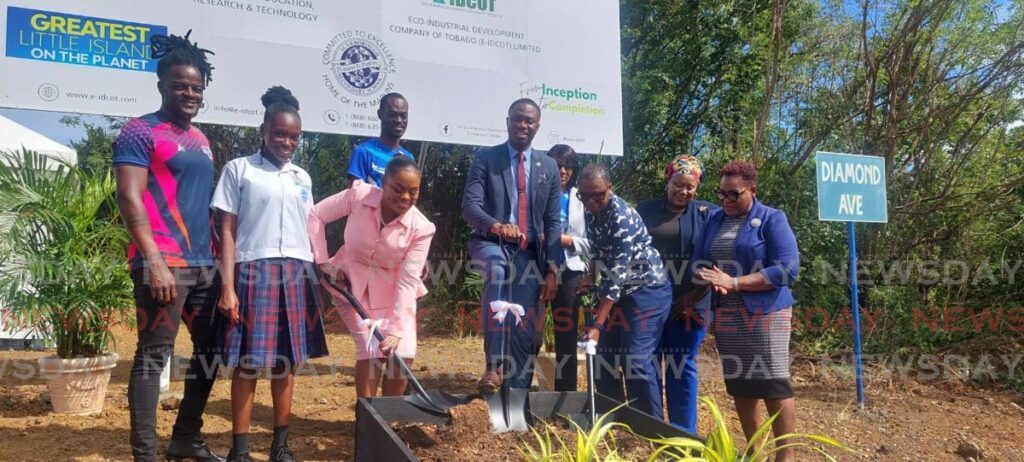 THA Chief Secretary Farley Augustine smiles as Secretary of education, research and technology Zorisha Hackett and the division's administrator Diane Baker Henry turn the sod for the constructon of the new Scarborough Secondary School at Bacolet Park on Friday. - Photo by Corey Connelly