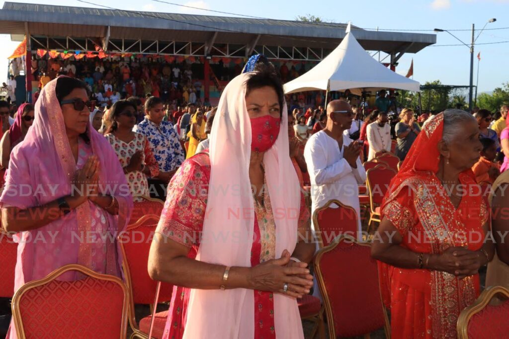 Devotees pray during the Shri Ram Janam Bhumi Sthapa committee celebration of the Ayodhya Ram Mandir Pran Pratishtha inauguration at the Pierre Road Recreation ground in Felicity on Sunday.  - Photo by Roger Jacob