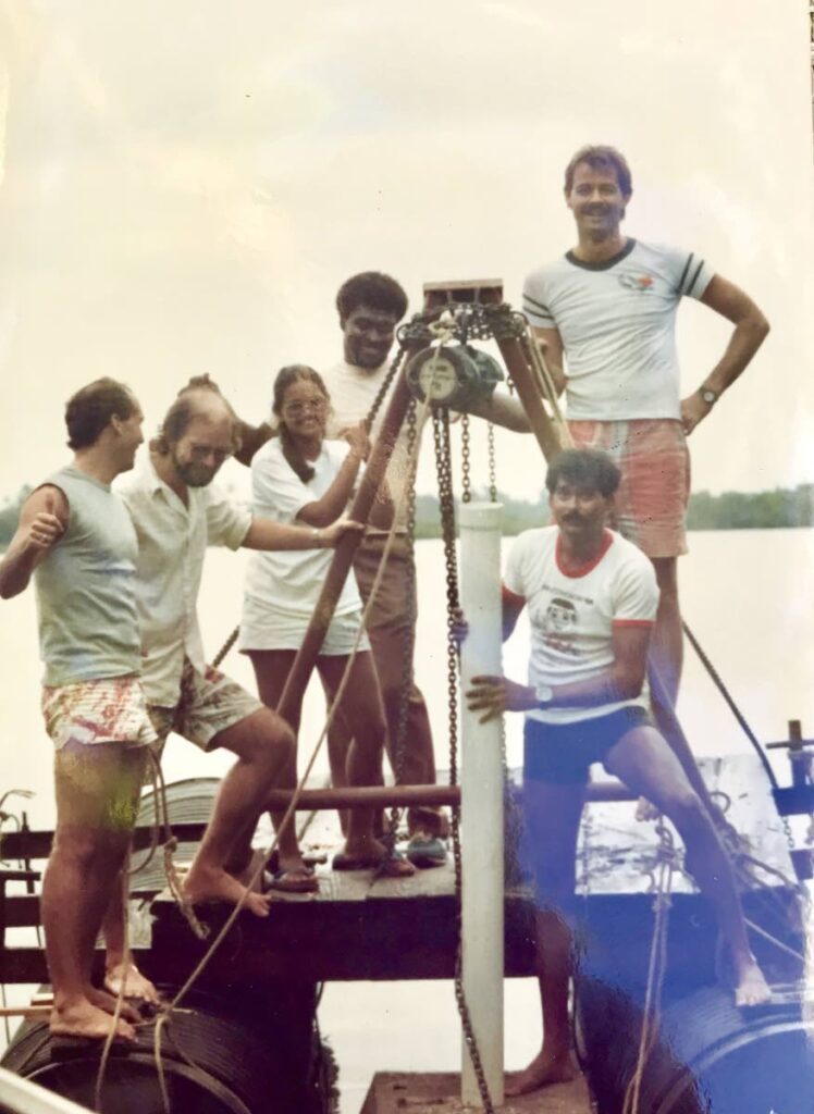 Members of Crusoe Reef Society installing navigational markers. - Photo courtesy Kevin Kenny 