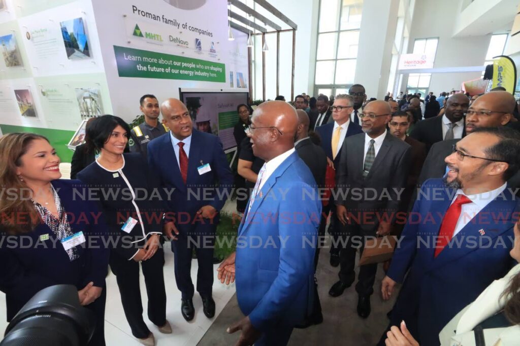 ENERGY TALKS: Prime Minister Dr Keith Rowley, centre, speaks with Proman TT's Managing Director (Operations) Aleeya Ali, 2nd from left, during the opening day of the TT Energy Conference and Trade Show 2024 at the Hyatt Regency, Port of Spain on Monday. - Photo by Roger Jacob