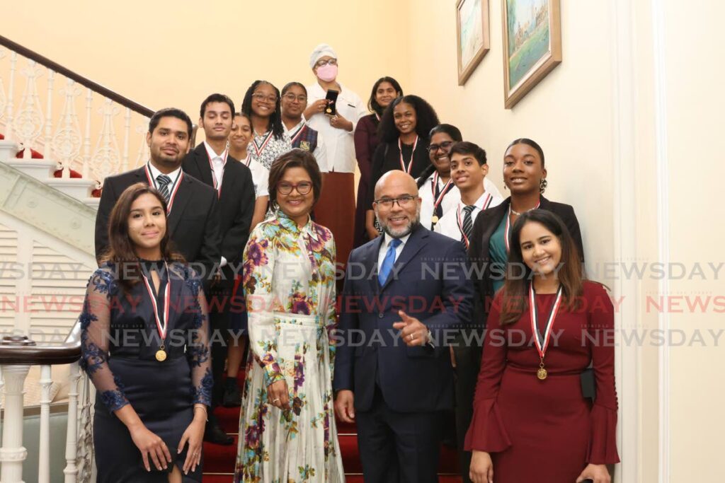 SMART PEOPLE: President's Medal winners for excellence in SEA, CSEC, CAPE and NEC exams for 2021 and 2022, with President Christine Kangaloo and her husband Kerwyn Garcia on Wednesday at President's House, St Ann's. PHOTO BY FAITH AYOUNG - Faith Ayoung