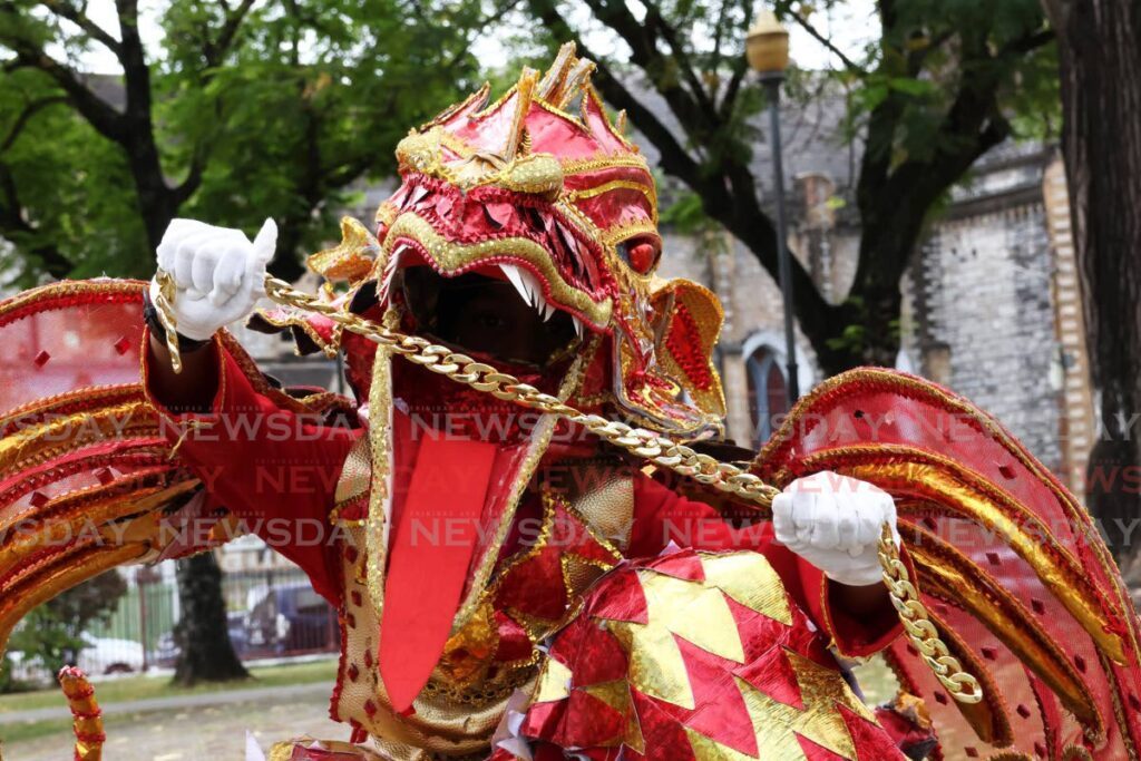 Jerimiah-Khalil Daniel gets into character with his signature roar as red dragon.  - Photo by Faith Ayoung