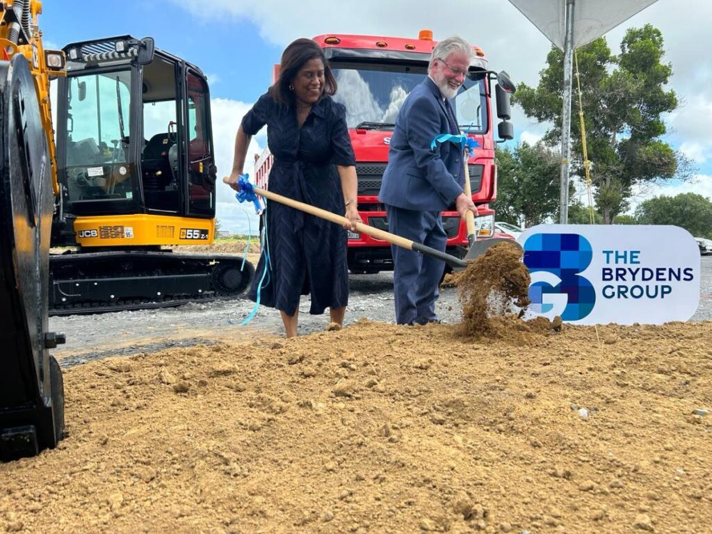 Trade and Industry Minister Paula Gopee-Scoon, left, and Brydens Group deputy chairman Michael Conyers turn sod for the group's regional distribution centre at the eTeck Park along Factory Road, Chaguanas on Friday. - Photo by Rishard Khan