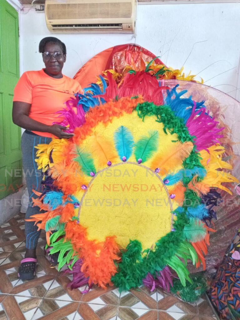 Veteran bandleader Marcellin Nedd shows one of her colourful costumes at her mas camp in Scarborough on January 26. - Photo by Corey Connelly