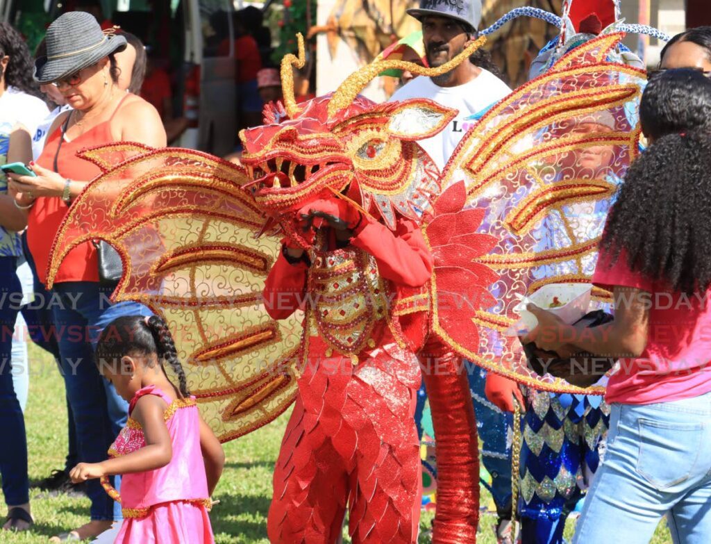 Jerimiah Daniel showcases Bologos the Red Dragon, from The Clan Mas Productions. - Photo by Roger Jacob