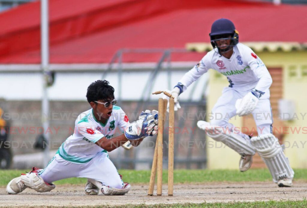 Naparima College captain Jonathan Ramnarace is run out by Princes Town West wicketkeeper Mathew Lum Kin during the Powergen Secondary Schools Cricket League at Lewis Street, San Fernando on Tuesday. - Photo by Lincoln Holder 