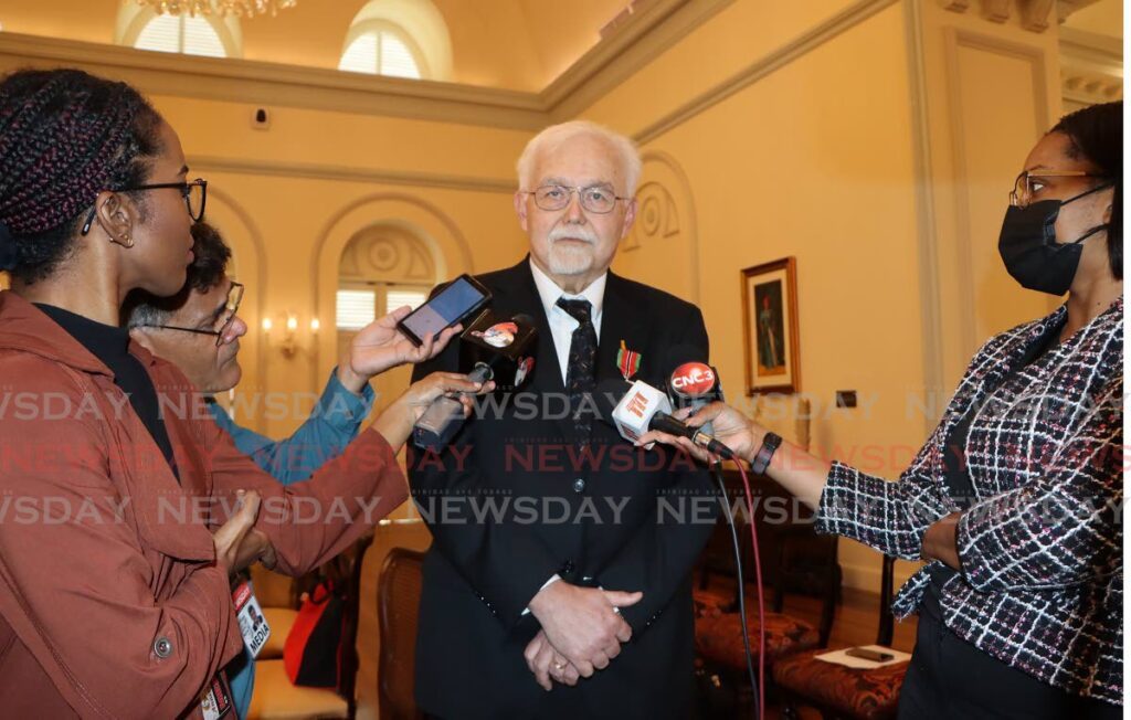 WHAT THE FUNK: Calypso archivist and retired US judge Ray Funk speaks with reporters shortly after receiving his Chaconia Medal (Silver) during a brief ceremony on Tuesday at President's House. - Photo by Angelo Marcelle