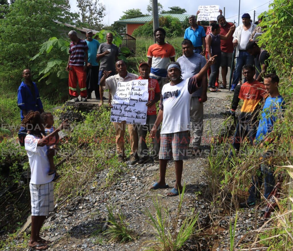 Residents of Pepper Village staged a protest on Monday morning calling on authorities to rebuild the collapsed Gran Couva Main Road after a WASA water main destroyed the road infrastructure some two years ago.
Gran Couva Main Road, Pepper Village Gran Couva. - Photo by Roger Jacob