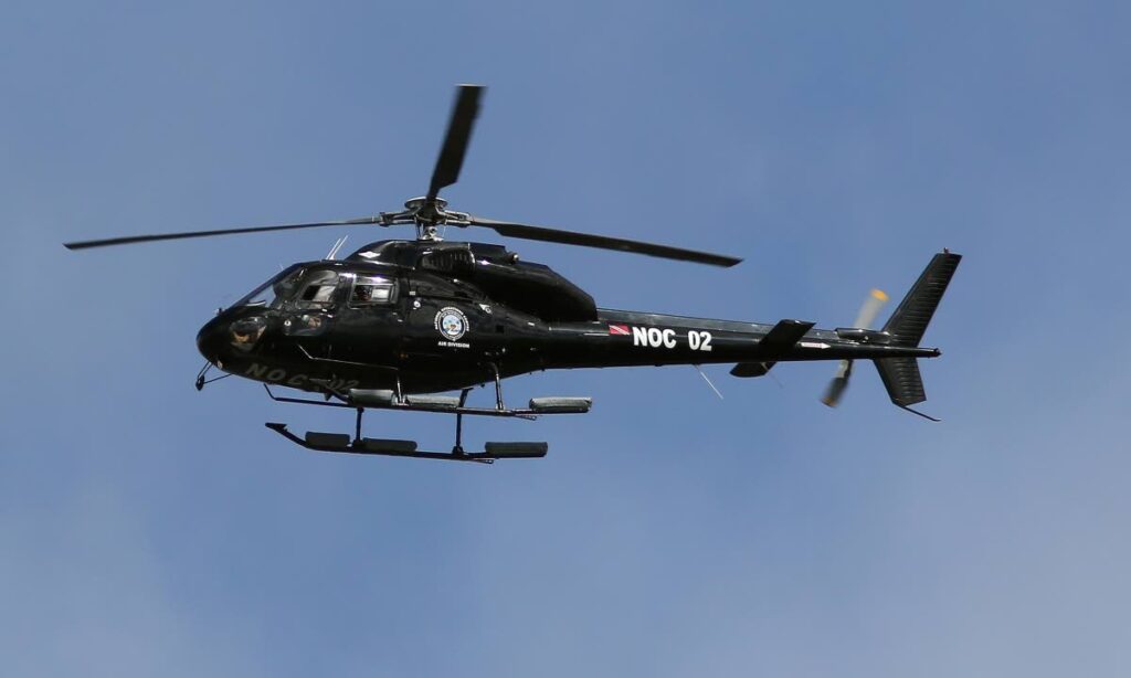 The National Operations Centre (NOC) helicopter hovering over the Queen's Park Oval during the United Arab Emirates  vs West Indies  ICC Under 19 cricket world cup in 2022. - File photo