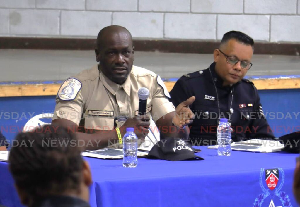 Snr Supt Miguel Montrichard addresses residents at a town hall meeting. - File photo by Roger Jacob