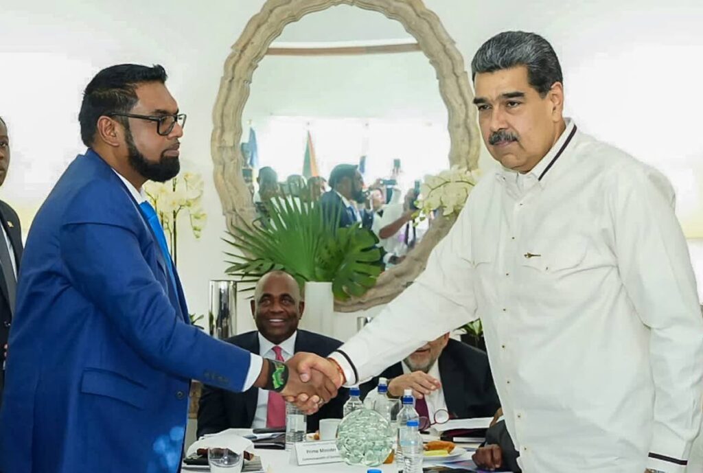 Guyanaese president Dr Irfaan Ali and Venezuelan president Nicolas Maduro greet during a meeting in St Vincent and the Grenadines on December 14, 2023. - From President Dr Irfaan Ali's Facebook 