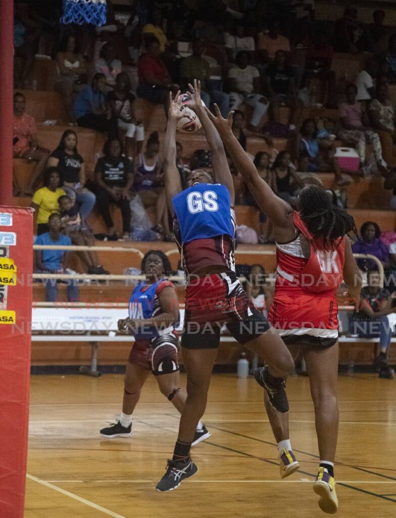 TTPost goal shooter Nekesha Gomes, left, vies for the ball with UTC Sparks goal keeper in the Courts All Sectors Netball knockout competition, at Eastern Regional Indoor Arena, Tacarigua. - File photo by Dennis Allen for @TTgameplan