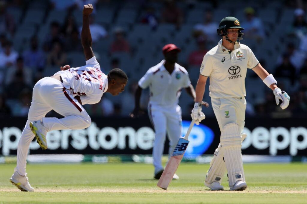 West Indies' Shamar Joseph, left, bowls as Australia's Steve Smith watches on the third day of their cricket test match in Adelaide, Australia, on January 19, 2024. - AP PHOTO