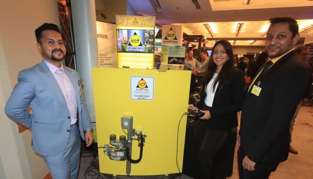 Riza Khan, vice president of operations, ICT Ltd, right, alongside senior engineers Kavir Ramdass and Gabrielle D' Andrade with the inspection robotic equipment used in the energy sector at the TT Energy Conference 2024 on January 22.  - ROGER JACOB
