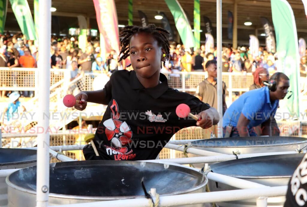 Merliq Nathaniel, 9, of NGC La Brea Nightingales, hits the right notes during the band's performance of Nah Leaving at Panorama medium conventional bands semi-finals at the Queen's Park Savannah, Port of Spain, on January 28. - Photo by Ayanna Kinsale