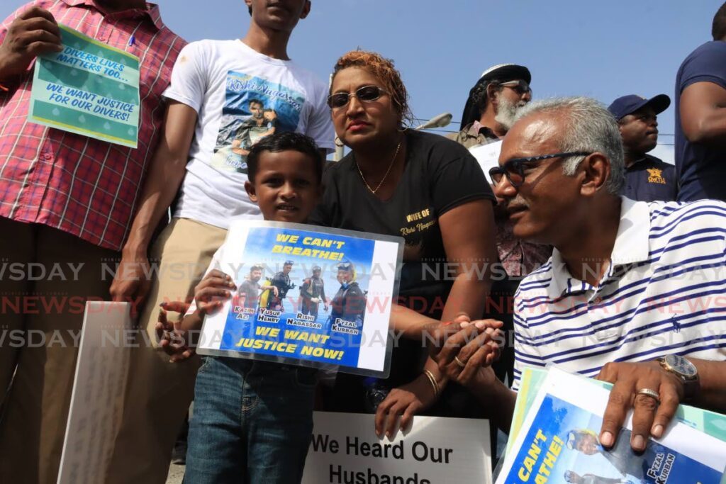  Vanessa Kussie and her four-year-old son Nashik Nagassar are greeted by Couva South MP Rudranath Indarsingh MP for Couva South, alongside relatives of her late husband, diver Rishi Nagassar, during a protest at Paria Fuel Trading Co Ltd, Pointe-a-Pierre on February 1. - Photo by Roger Jacob