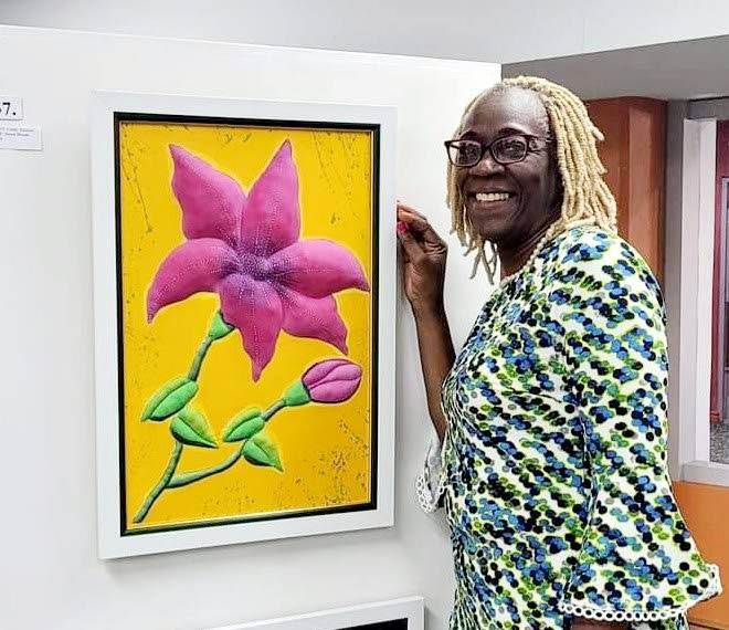 CINDY HACKETT shows her piece, Sweet Bloom. - 