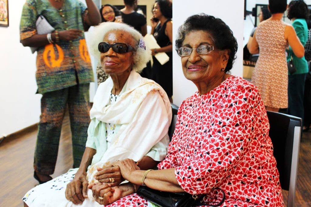 WIAOTT founder Fraulein Rudder with the organisation's patron, Zalayhar Hassanali, at a WIAOTT exhibition. Photo courtesy Women In Art Organisation of Trinidad and Tobago