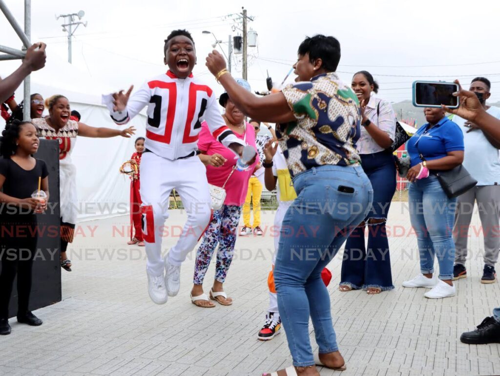 Zachary Ransome jumps for joy after being crowned the Junior Soca Monarch (primary schools) champ on Thursday at the Queen's Park Savannah. - Photo by Ayanna Kinsale