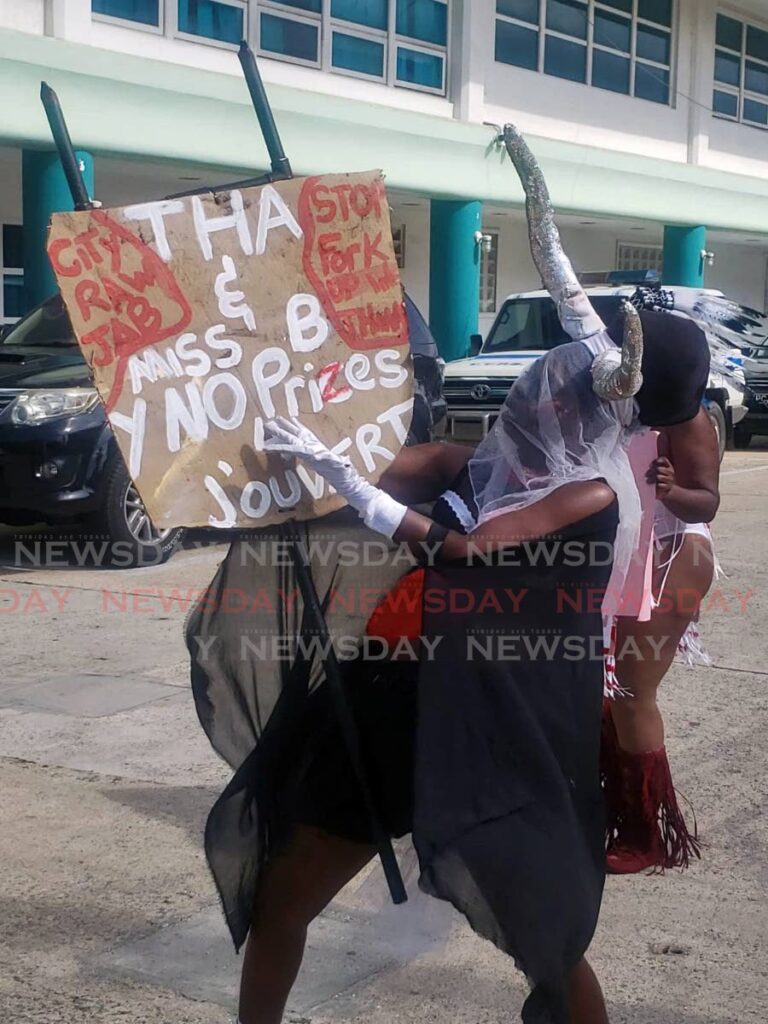 Bandleaders protest outside the Division of Tourism, Culture, Antiquities and Transportation in Scarborough on Monday. - 