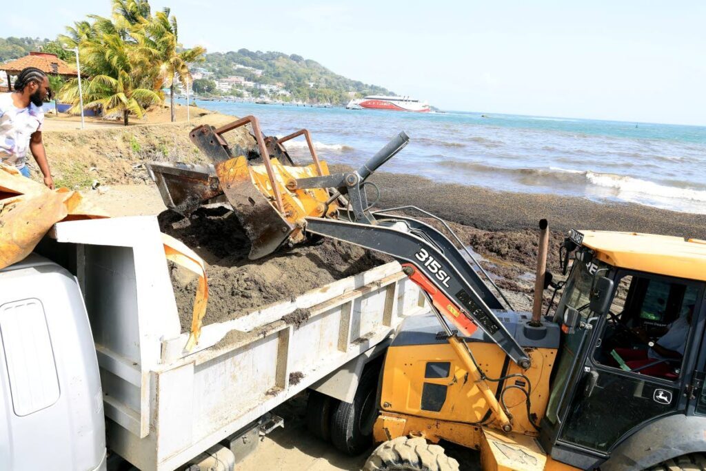 Cleanup efforts underway at Scarborough after an oil spill from an overturned vessel near Canoe Bay, Tobago.  - THA