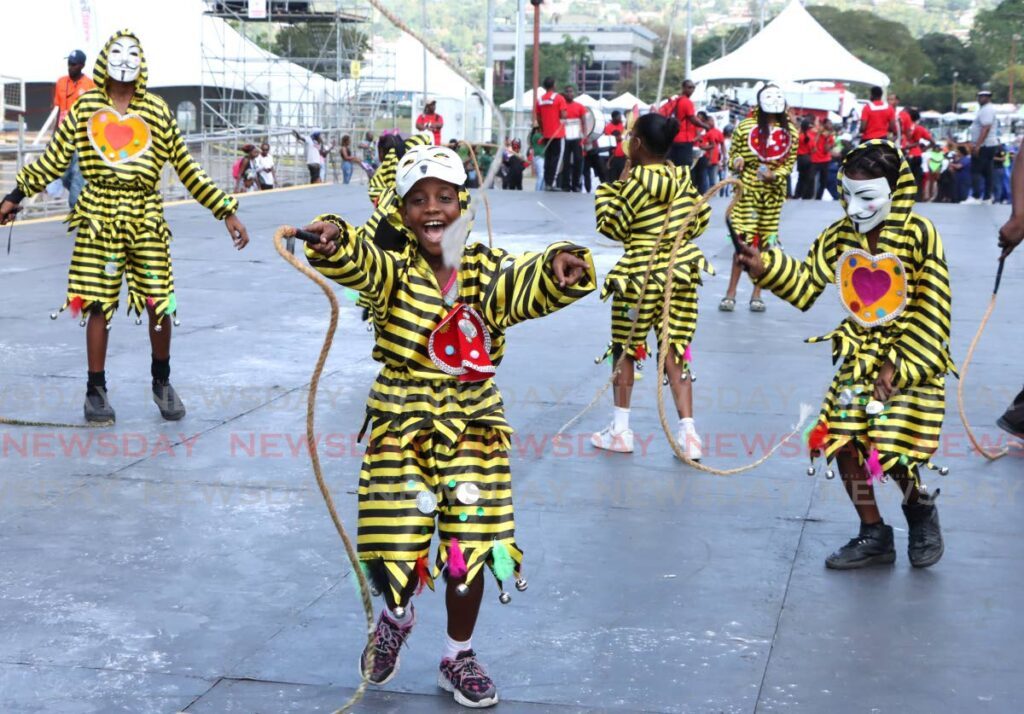 JAB JAB FEVER: La Horquetta South Government School portrays Jab Jab during the Carnival Downtown Parade at the Queen's Park Savannah, Port of Spain on February 9. - Photo by Ayanna Kinsale