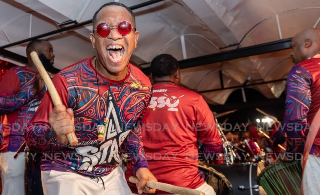 A Massy All Stars pannist is fired up during the band's performance to tie with bp Renegades in the Panorama large-band finals at Queen's Park Savannah, Port of Spain on February 10. - Photo by Jeff K. Mayers