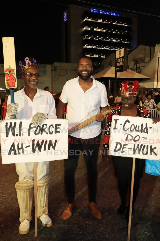Port of Spain Mayor Chinua Alleyne, centre, congratulates King and Queen of J'Ouvert 2024, Andre Villaruel, left, and Laverne Smith, right, at the Downtown Carnival Committee J'Ouvert competition on Carnival Monday. - Photo by Roger Jacob