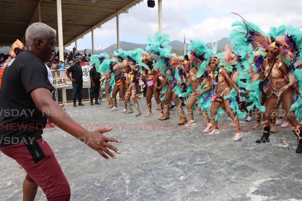 Showtime Mas bandleader Godfrey Enile get the masqueraders ready to trample the stage at the Queen’s Park Savannah, Port of Spain on Carnival Tuesday. - Angelo Marcelle