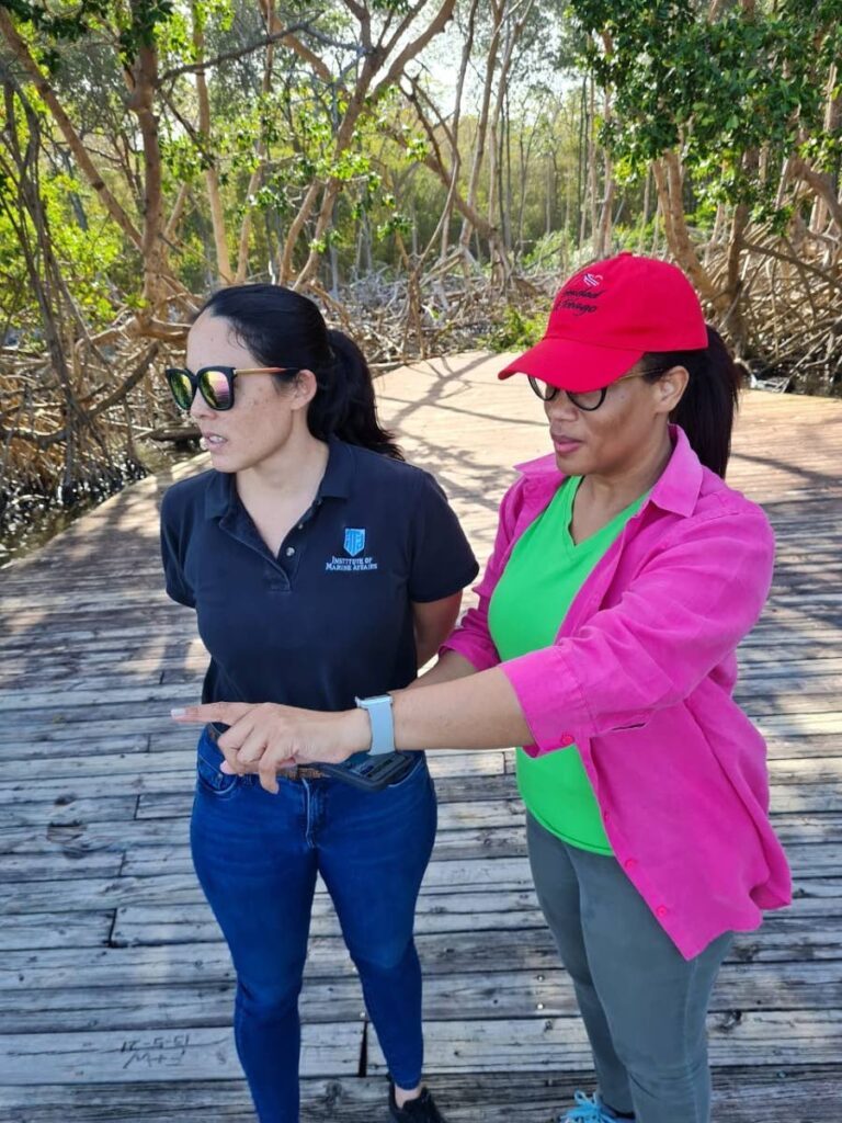 Institute of Marine Affairs director Dr Ava Maxam, right, and coral reef ecologist Dr Anjani Ganase, on a site visit to the Petit Trou lagoon in Tobago. - Photo courtesy IMA