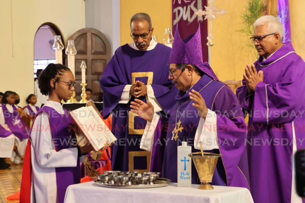 Archbishop Jason Gordon preparing the ashes as he officiated the Ash Wednesday mas at Our Lady of Perpetual Help church, San Fernando on Wednesday.  - Lincoln Holder 