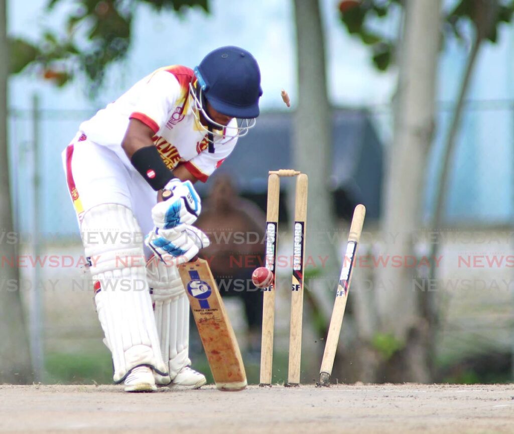 Hillview College captain Andre Suglal is bowled during  the Secondary Schools Cricket League premiership match against Naparima College at Lewis Street San Fernando. - Lincoln Holder 