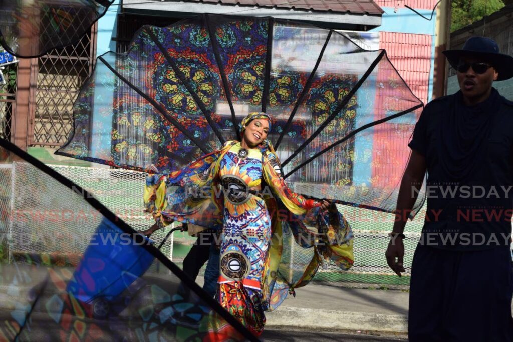 A masquerader from K2K Alliance & Partners' The Salt Crossing enjoying her mas in Port of Spain on Carnival Tuesday, February 13.  - 