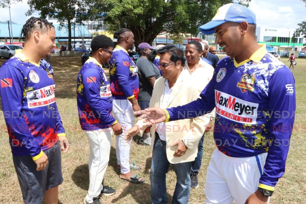 Agents Cricket Club captain Stefan Gopie (R), introduces his team to Arima Mayor Balliram Maharaj at the launch of the East Zone Cricket League, at the Princess Royal Park, Arima on February 17. - Photo by Angelo Marcelle