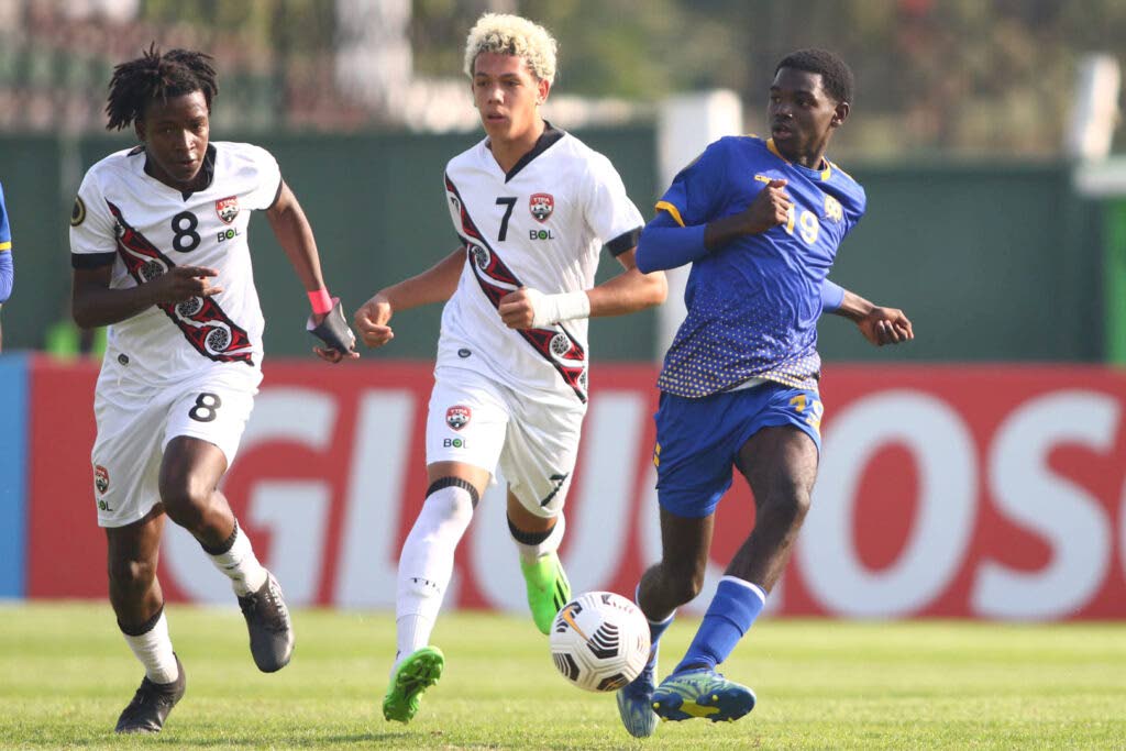 In this file photo, Barbados midfielder Ajanie Payne (R) looks to pass the ball as TT's Josiah Ochoa (L) and Rio Cardines defend during a Concacaf U-17 Championship encounter on February 15, 2023. - Photo courtesy Concacaf Media