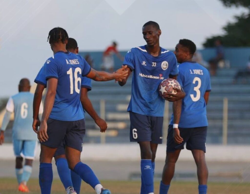 Police FC players celebrate a goal in the TTPFL on Sunday. - 