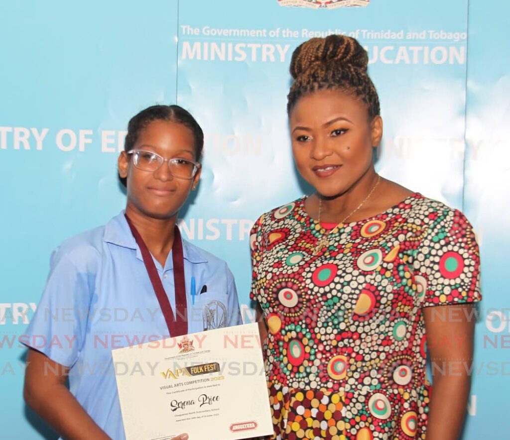 Education Minister Dr Nyan Gadsby-Dolly with Serena Price, a student of Chaguanas North Secondary who placed third in the ministry's visual arts competition on February 19. - Photo by Faith Ayoung