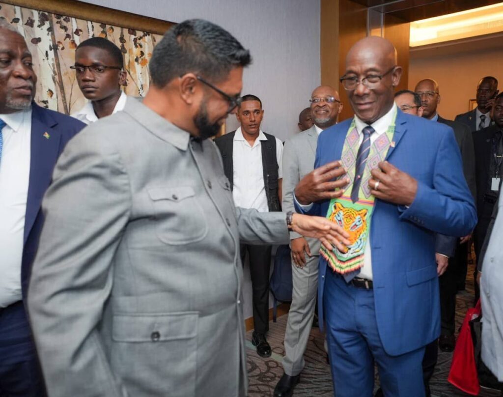 Guyana President Dr Irfaan Ali, left, interacts with TT Prime Minister Dr Keith Rowley on the opening day of the Guyana Energy Conference and Supply Chain Expo 2024, at the Marriott Hotel, Guyana on February 19. Photo courtesy Dr Irfaan Ali's X page. - 