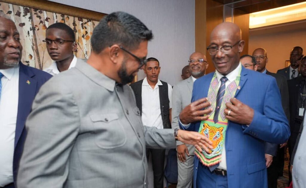 Guyana President Dr Irfaan Ali, left, interacts with TT Prime Minister Dr Keith Rowley on the opening day of the Guyana Energy Conference and Supply Chain Expo 2024, at the Marriott Hotel, Guyana on February 19. - Photo courtesy Dr Irfaan Ali's X page.