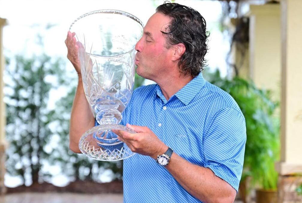 Victory Kiss: Stephen Ames celebrates his victory at the Chubb Classic in Florida on Sunday. It was his seventh PGA Tour Champions title. - Photo courtesy Marilyn Ames. 