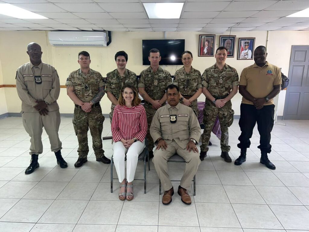 Harriet Cross, British High Commissioner to TT and ASP Michael Sooker, flanked by Members of the Household Cavalry Mounted Regiment and TTPS Mounted Branch - Photo courtesy the British High Commission