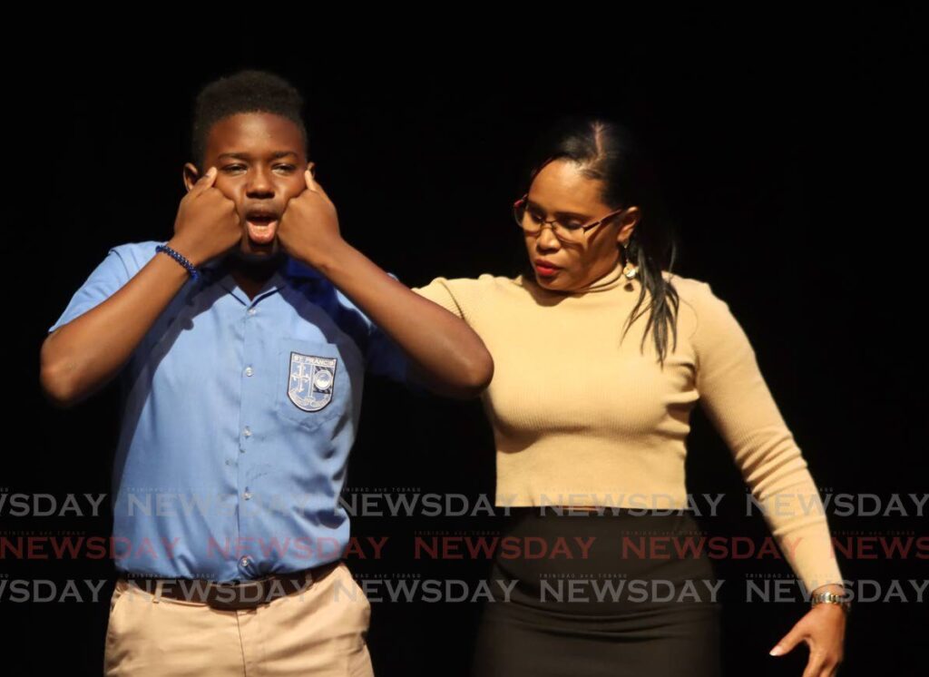 TT Music Festival adjudicator Nadine Gonzales gives pointers to eventual winner of the Boys 13-15 Carols winner Che De Leon of St Francis Boys College , at Queen's Hall, Port of Spain on  Wednesday. The judge gave similair feedback to all the other contestants in the category. - Angelo Marcelle