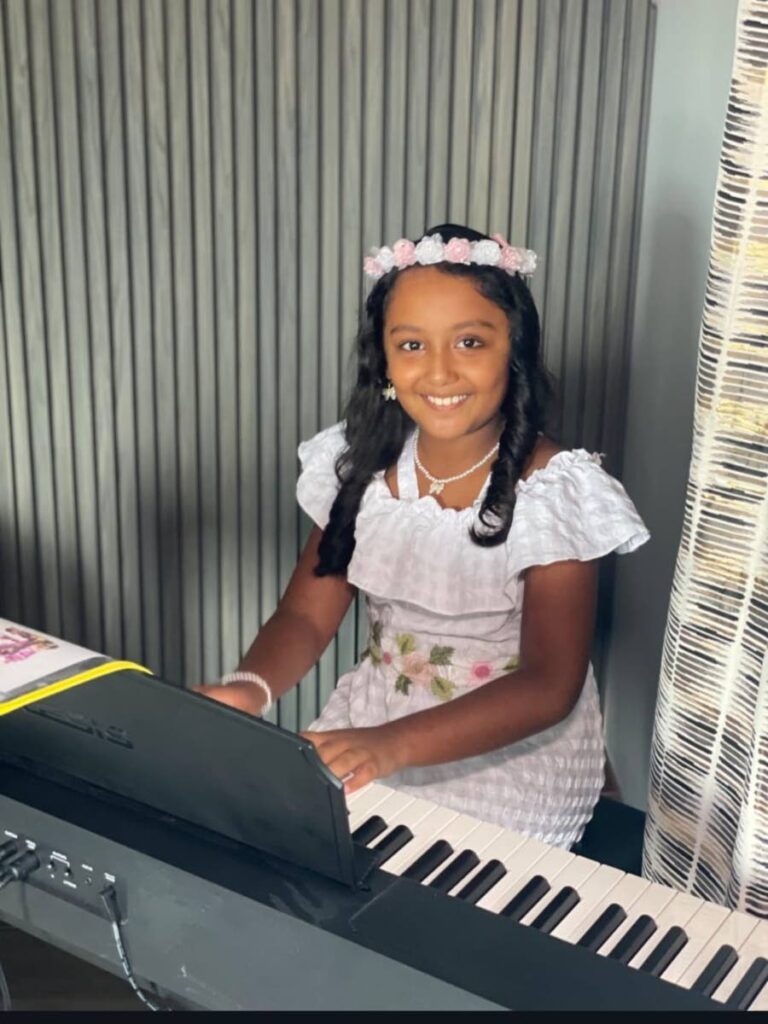 Tykailiah Worrell says music takes her to an imaginary world, where she can sing dance and play the piano.  - 