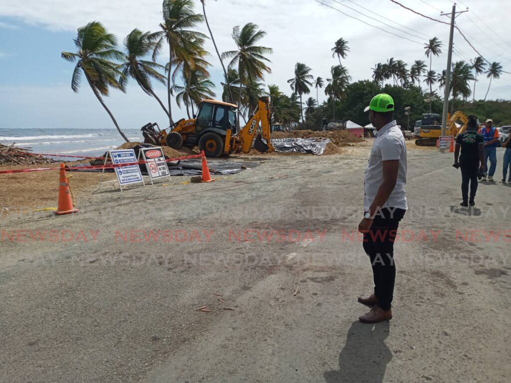 THA Chief Secretary Farley Augustine looks on at the work being done at Petit Trou beach Lambeau, Tobago during a tour of areas affected by the oil spill on February 20. - Photo by Jaydn Sebro